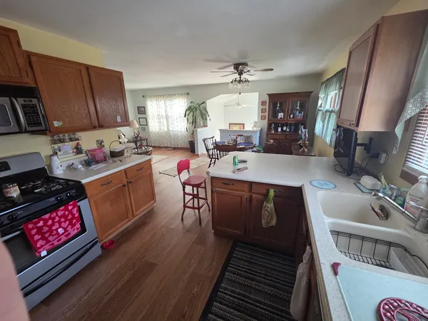a kitchen with a sink stove and cabinets