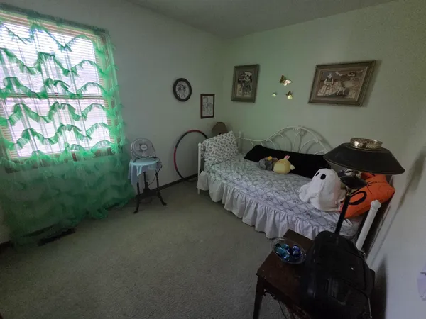 a bed room with furniture and a window