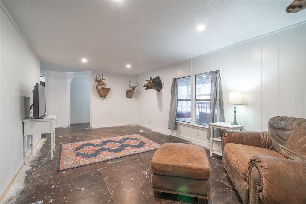 17540 Old George Drive Terrell, TX 75160 - Photo 16 of 28 a bedroom with a bed a couch and large window