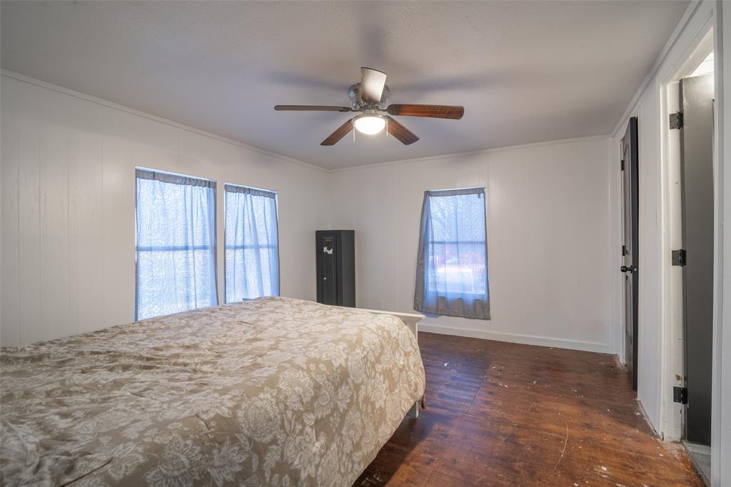 17540 Old George Drive Terrell, TX 75160 - Photo 17 of 28 a bedroom with a large bed and a window