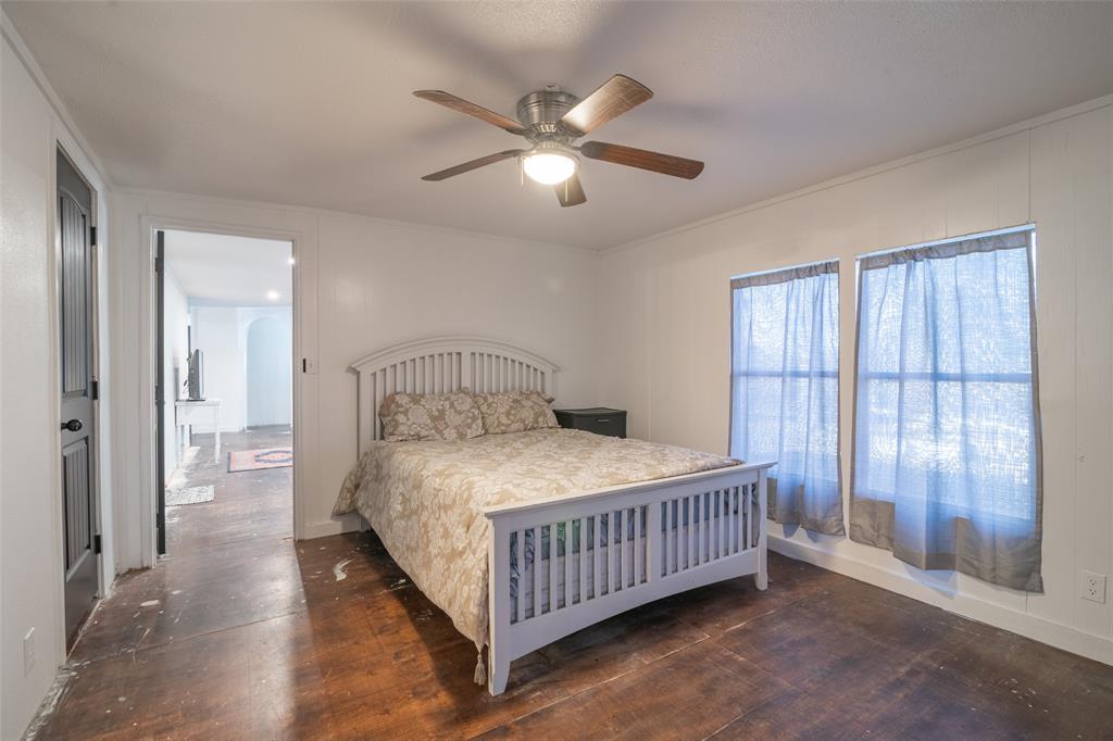 17540 Old George Drive Terrell, TX 75160 - Photo 18 of 28 a bedroom with a bed and large window