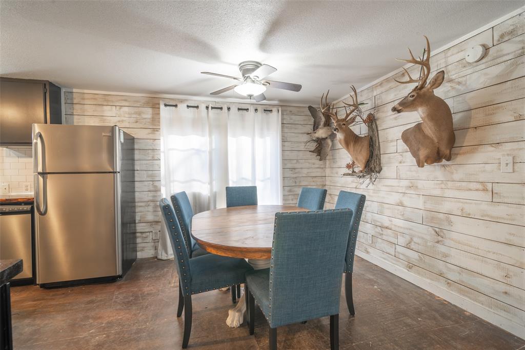 17540 Old George Drive Terrell, TX 75160 - Photo 7 of 28 a dining room with furniture and a refrigerator