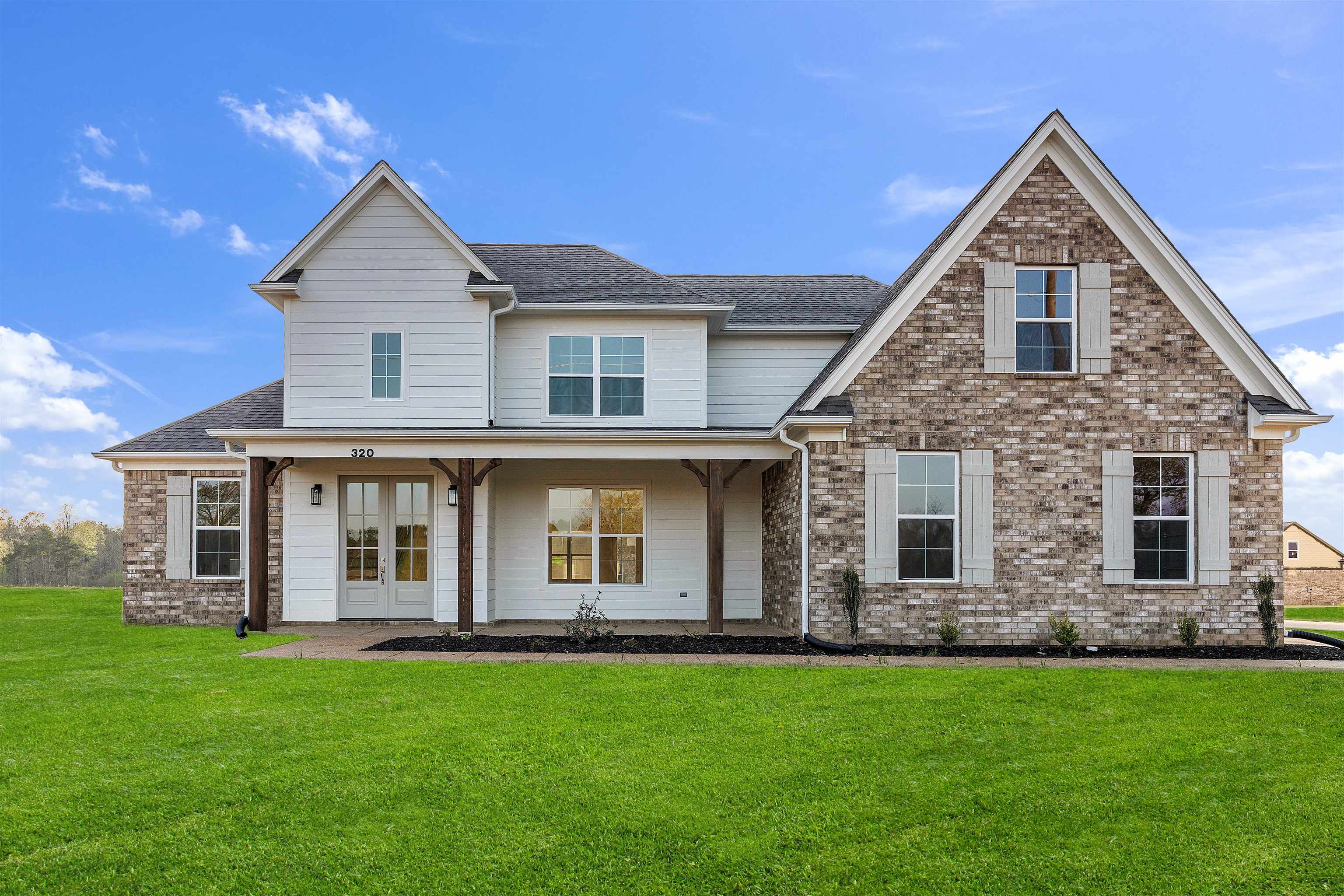 a front view of a house with a yard
