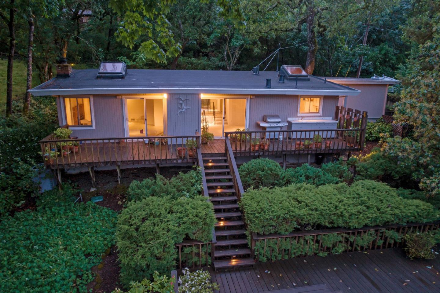 21661 Woolaroc Drive Los Gatos, CA 95033 - Photo 20 of 48 a front view of a house with garden