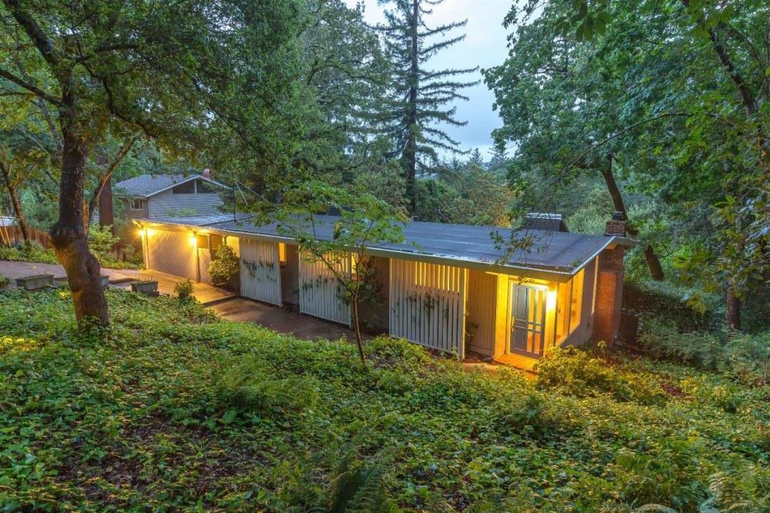 21661 Woolaroc Drive Los Gatos, CA 95033 - Photo 30 of 48 a view of a backyard with large trees and wooden fence