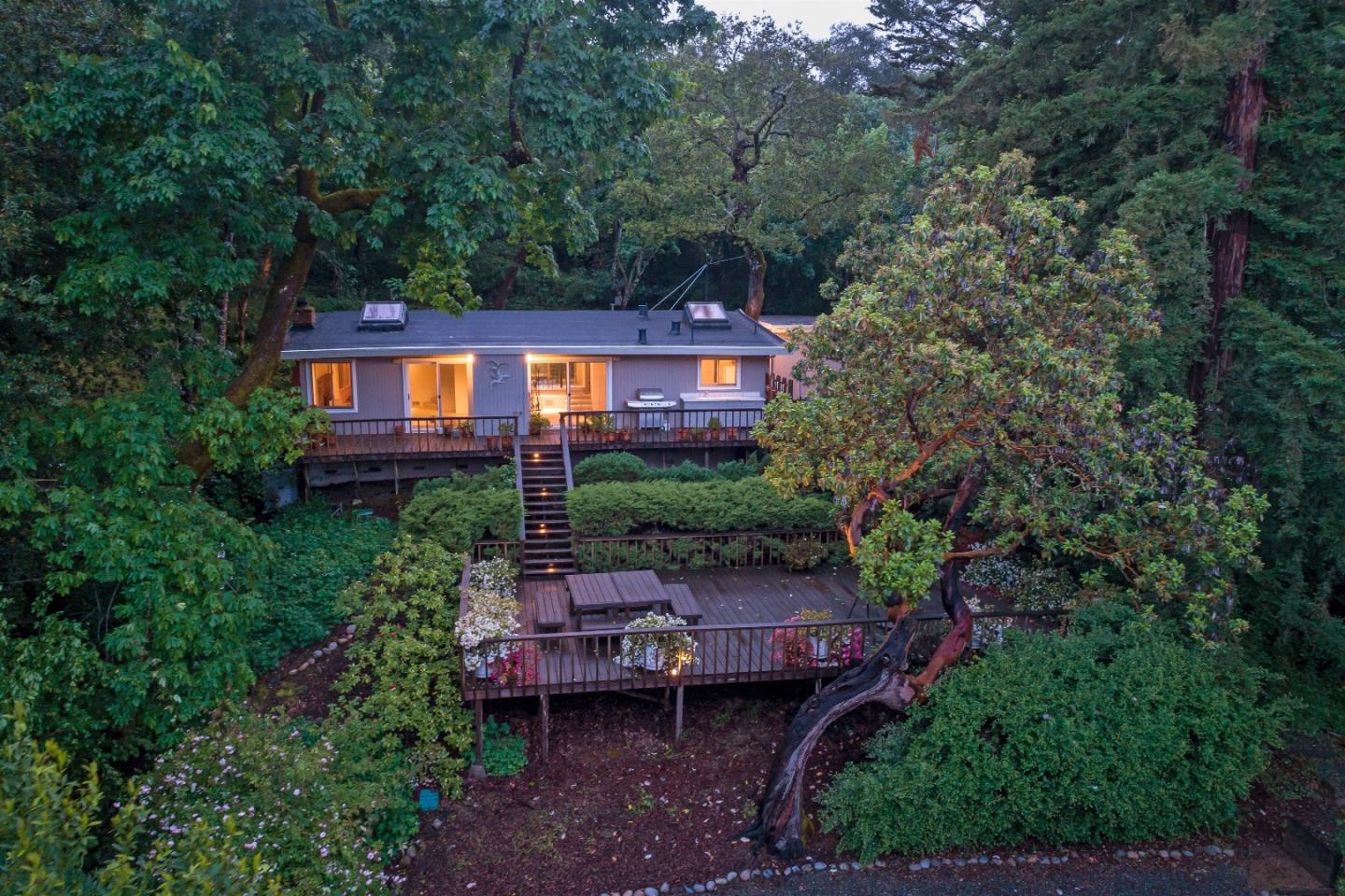 21661 Woolaroc Drive Los Gatos, CA 95033 - Photo 35 of 48 a view of a chairs and table in backyard of the house
