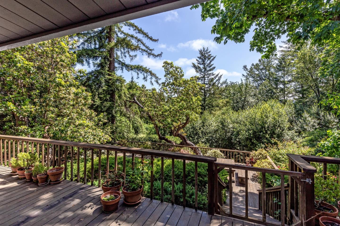 21661 Woolaroc Drive Los Gatos, CA 95033 - Photo 39 of 48 a view of a balcony with wooden floor and outdoor seating