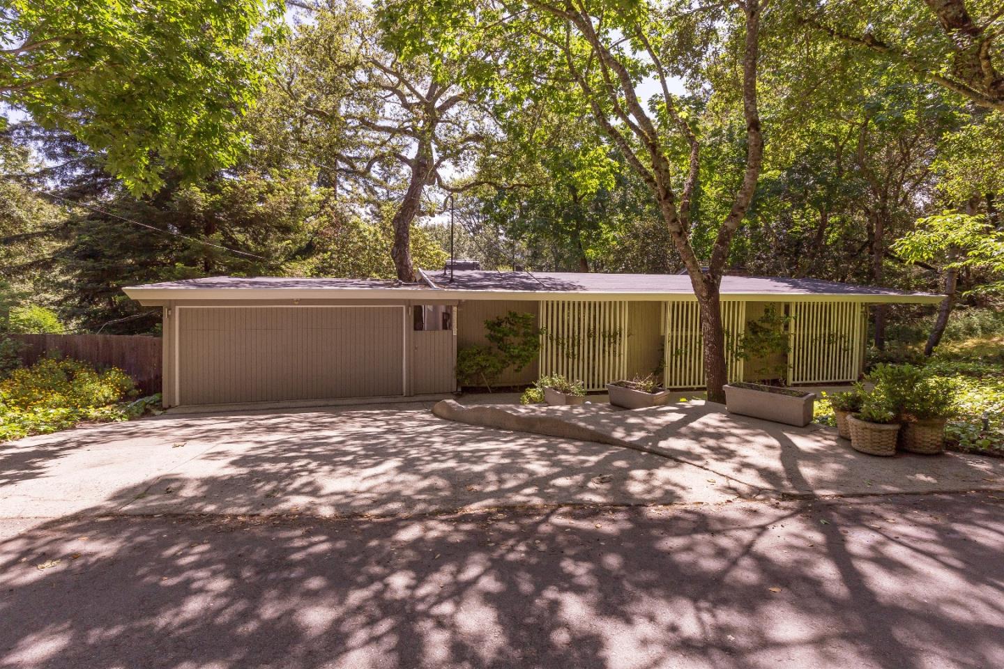 21661 Woolaroc Drive Los Gatos, CA 95033 - Photo 4 of 48 a view of a house with backyard and sitting area