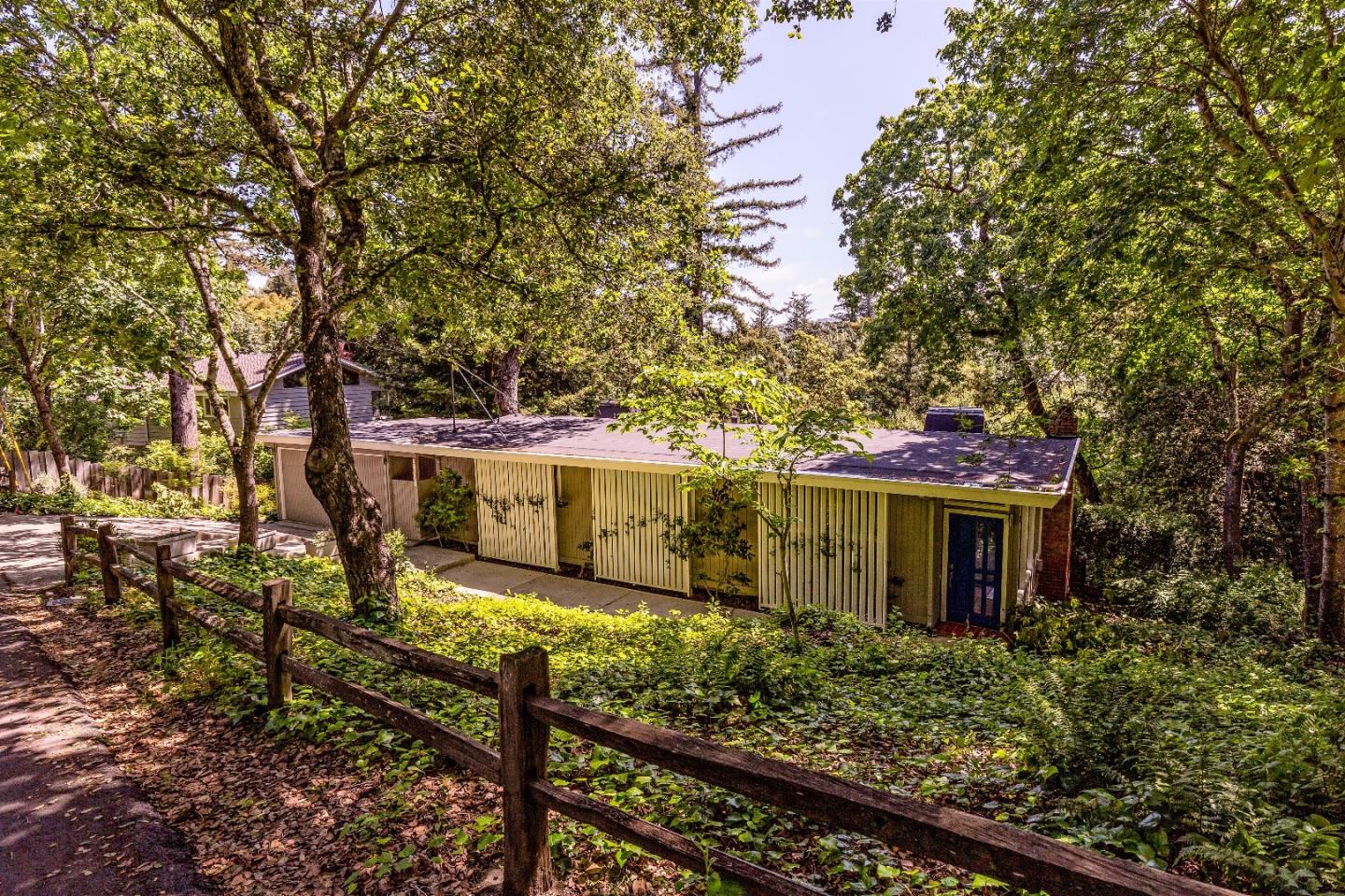 21661 Woolaroc Drive Los Gatos, CA 95033 - Photo 5 of 48 a view of a house with a large tree and a yard