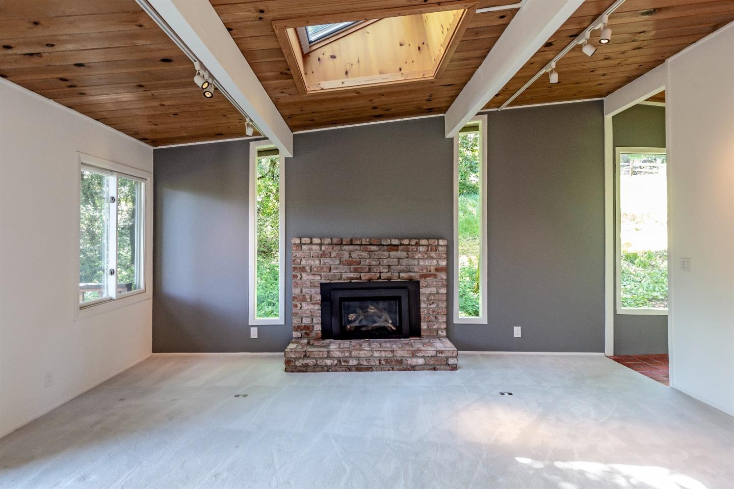 21661 Woolaroc Drive Los Gatos, CA 95033 - Photo 8 of 48 a living room with furniture and a fireplace