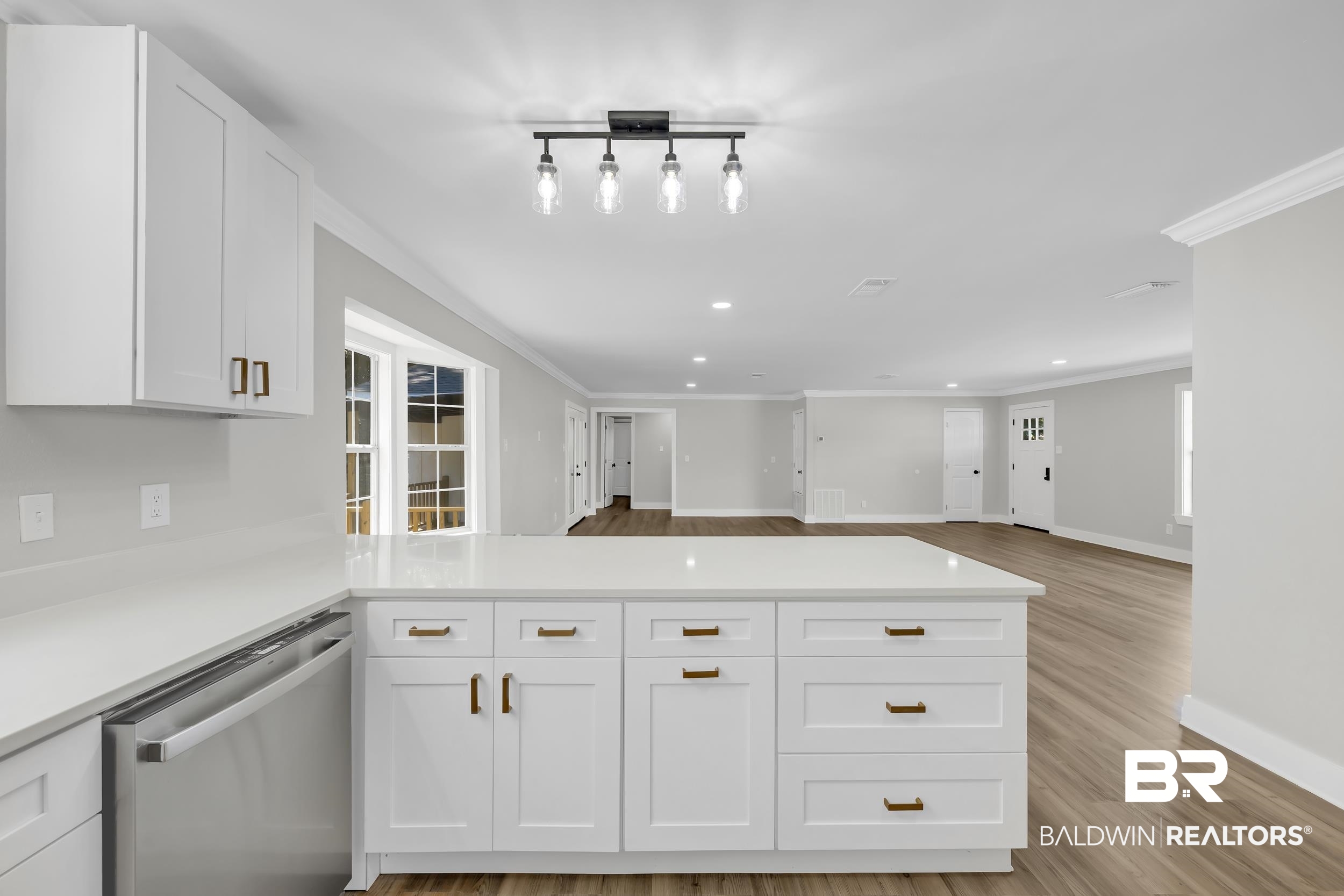 8351 Theodore Dawes Road Theodore, AL 36582 - Photo 45 of 46 Kitchen with white cabinets, dishwasher, open floor plan, light wood-style floors, and a peninsula