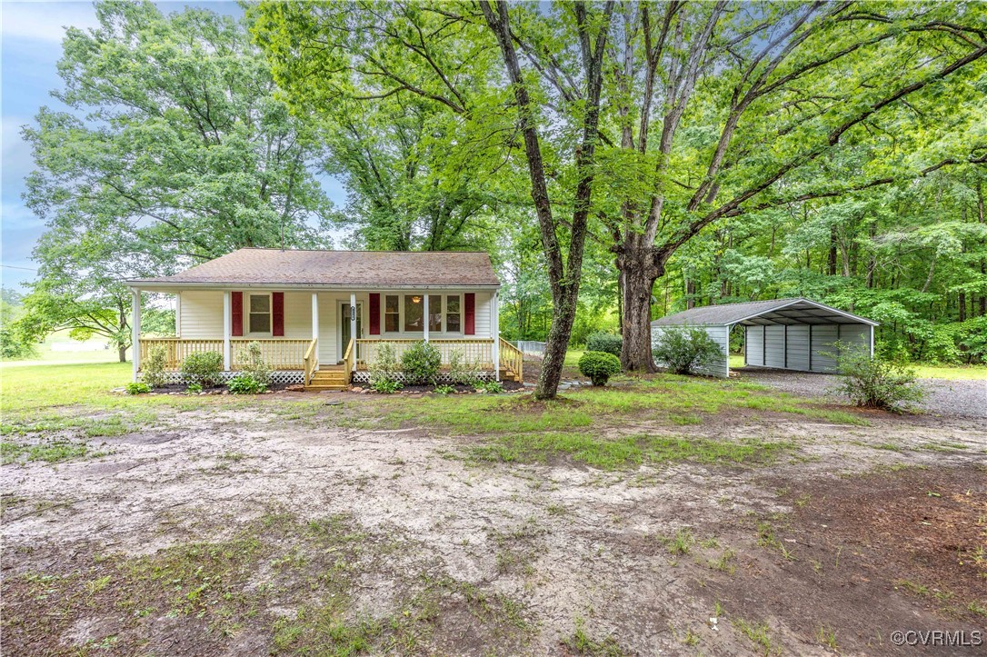 4593 Tabscott Road Columbia, VA 23038 - Photo 17 of 24 a front view of a house with yard and green space