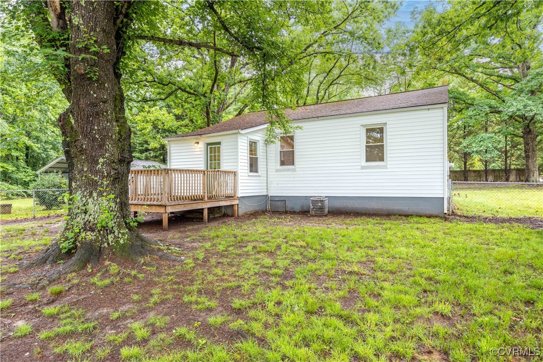 4593 Tabscott Road Columbia, VA 23038 - Photo 19 of 24 a backyard of a house with barbeque oven table and chairs