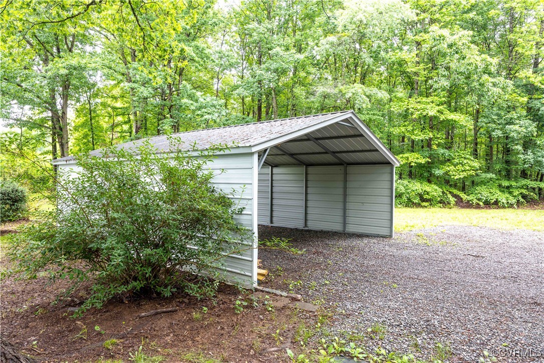 4593 Tabscott Road Columbia, VA 23038 - Photo 21 of 24 a backyard of a house with lots of green space