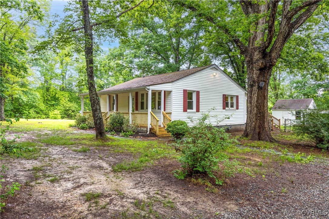 4593 Tabscott Road Columbia, VA 23038 - Photo 3 of 24 a front view of a house with yard and green space