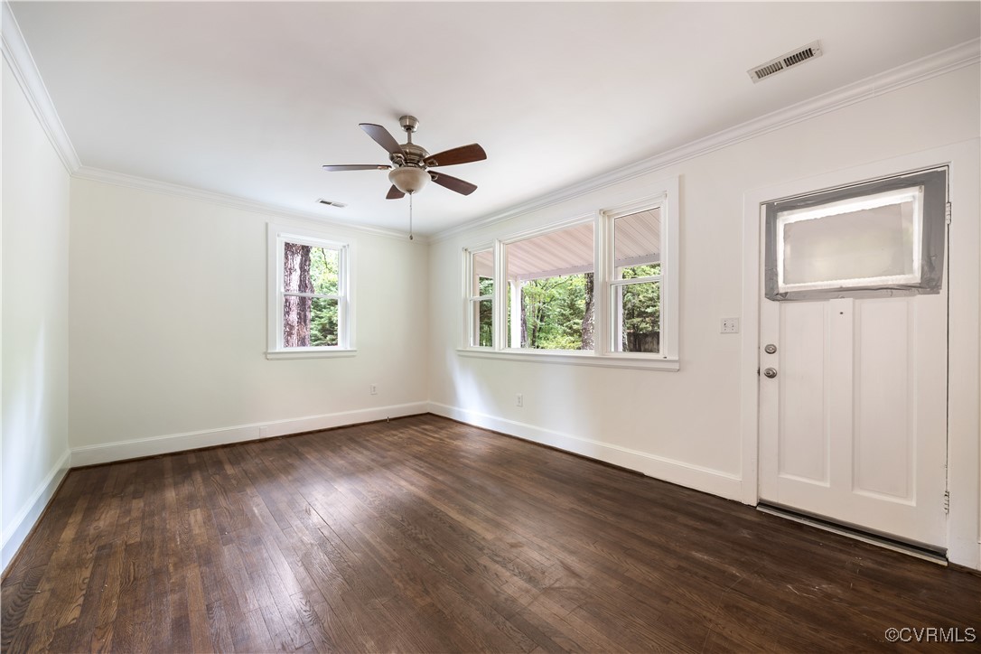 4593 Tabscott Road Columbia, VA 23038 - Photo 4 of 24 a view of empty room with wooden floor and fan