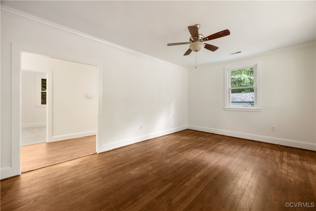 4593 Tabscott Road Columbia, VA 23038 - Photo 5 of 24 a view of empty room with wooden floor and ceiling fan