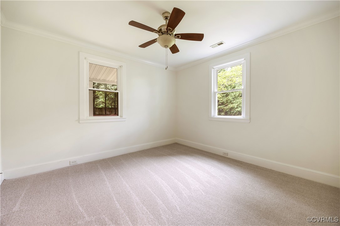 4593 Tabscott Road Columbia, VA 23038 - Photo 8 of 24 an empty room with a window and a ceiling fan