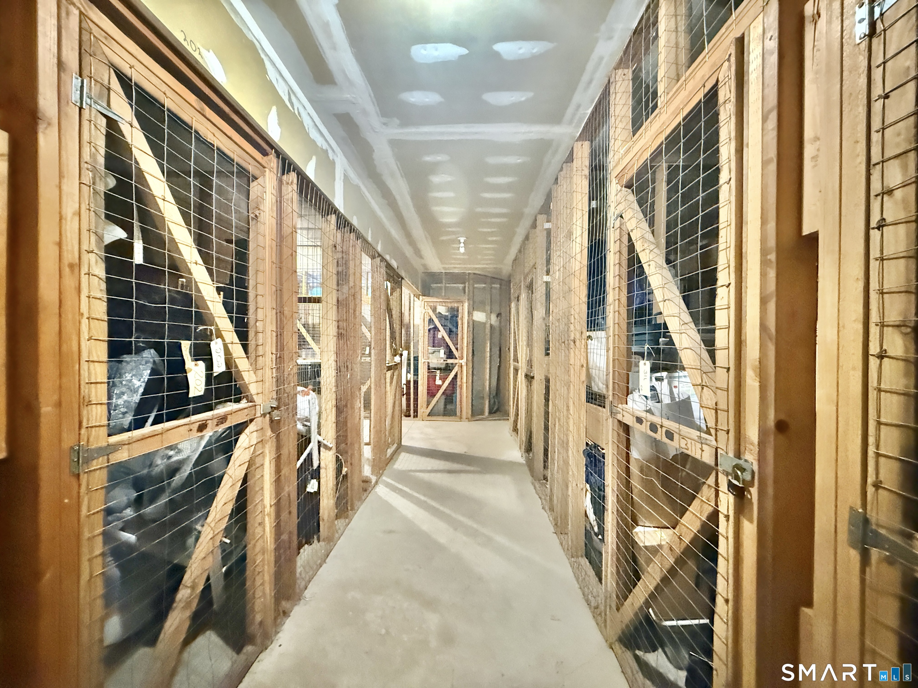 34 A Padanaram Road, Unit 127 Danbury, CT 06811 - Photo 13 of 13 a view of a hallway with wooden floors and stairs