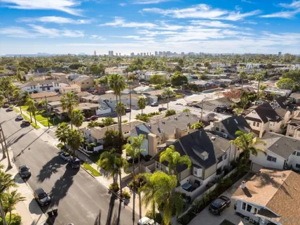 an aerial view of multiple houses with outdoor space