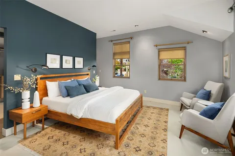 a bedroom with a bed and a cabinets