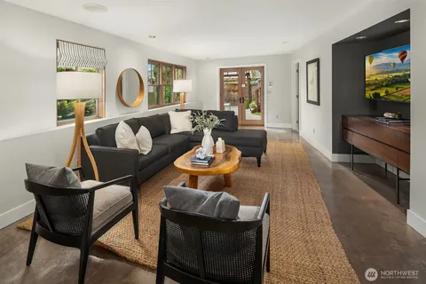 a living room with furniture and a window