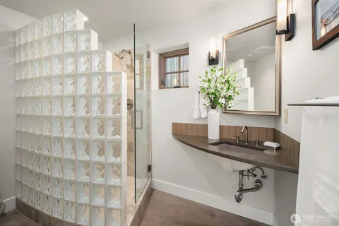 a bedroom with a bed chair and window