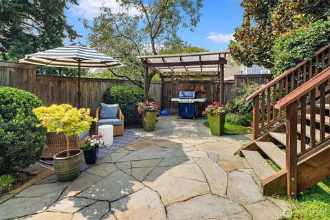 a front view of a house with garden