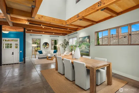 a view of a dining room with furniture window and outside view