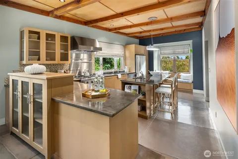 a kitchen with a stove and a table