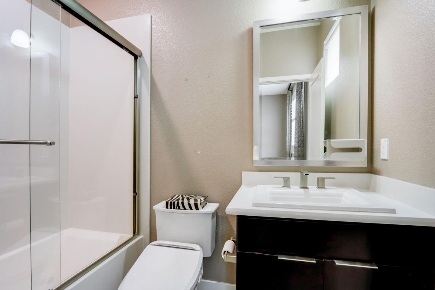706 Ave One Drive San Jose, CA 95123 - Photo 18 of 60 a bathroom with a sink and a mirror