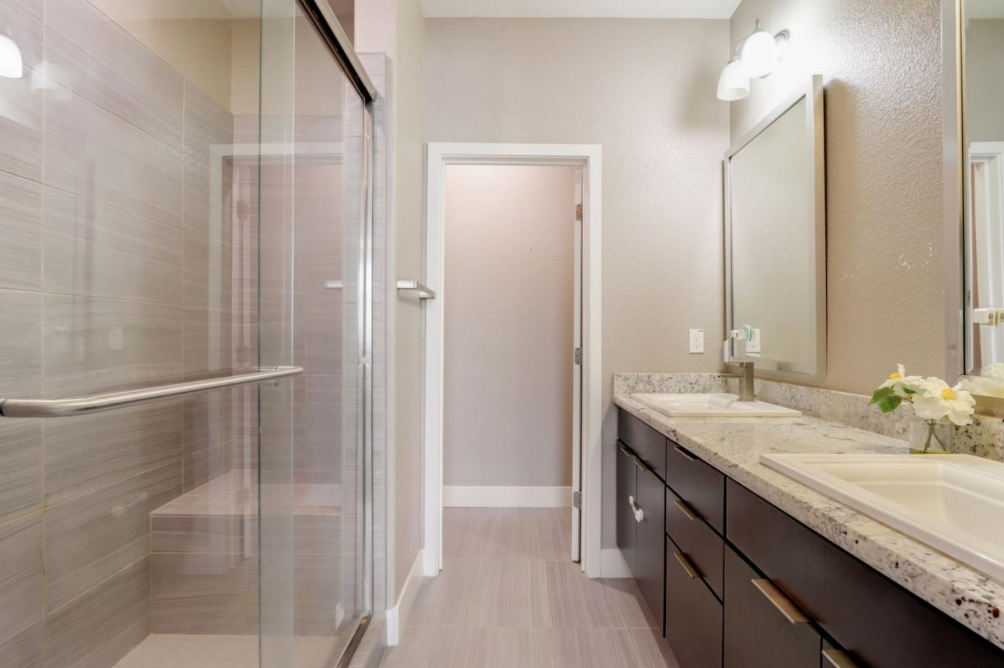 706 Ave One Drive San Jose, CA 95123 - Photo 23 of 60 a bathroom with a granite countertop sink and a mirror