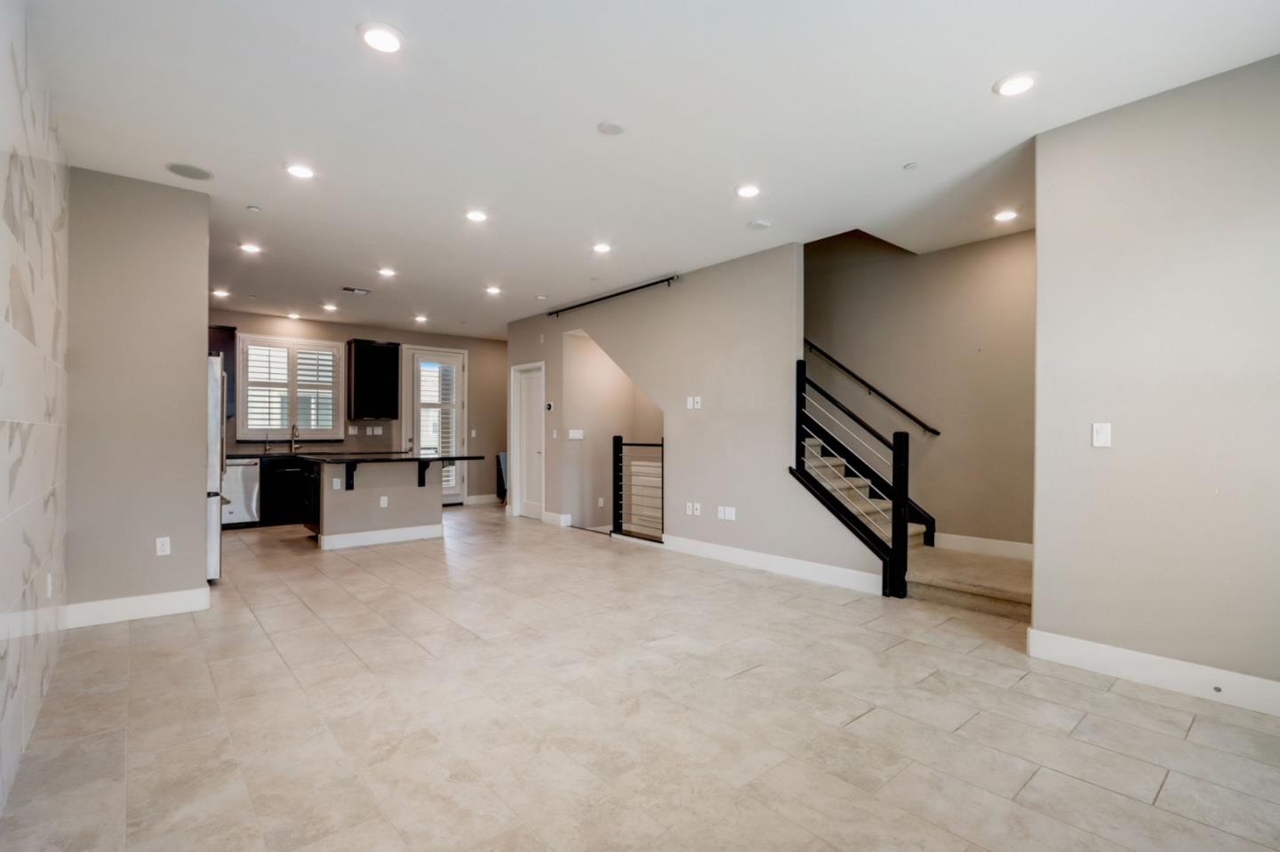 706 Ave One Drive San Jose, CA 95123 - Photo 3 of 60 an empty room with wooden floor and white walls