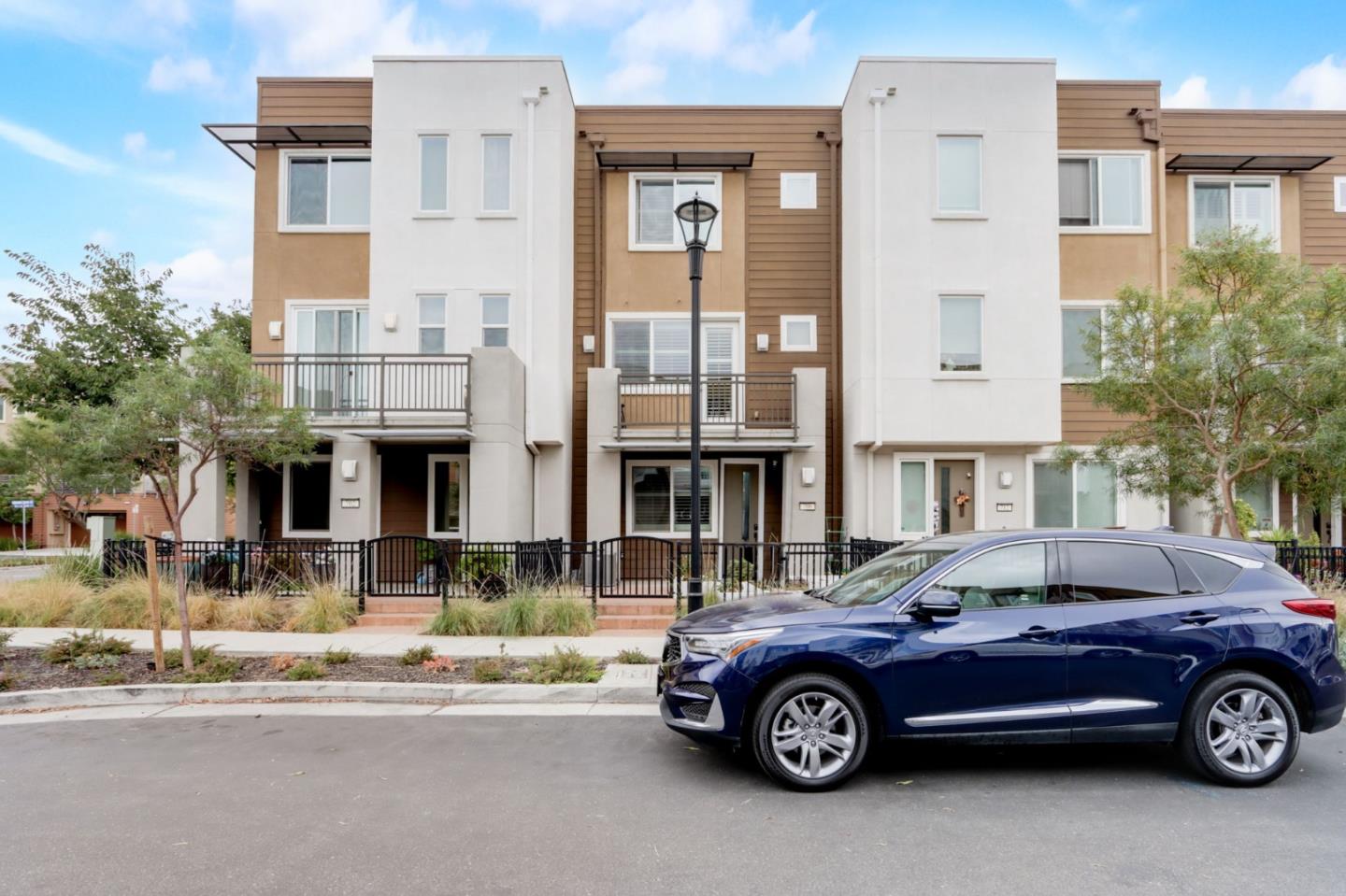 706 Ave One Drive San Jose, CA 95123 - Photo 37 of 60 a front view of a residential apartment building with a parking space