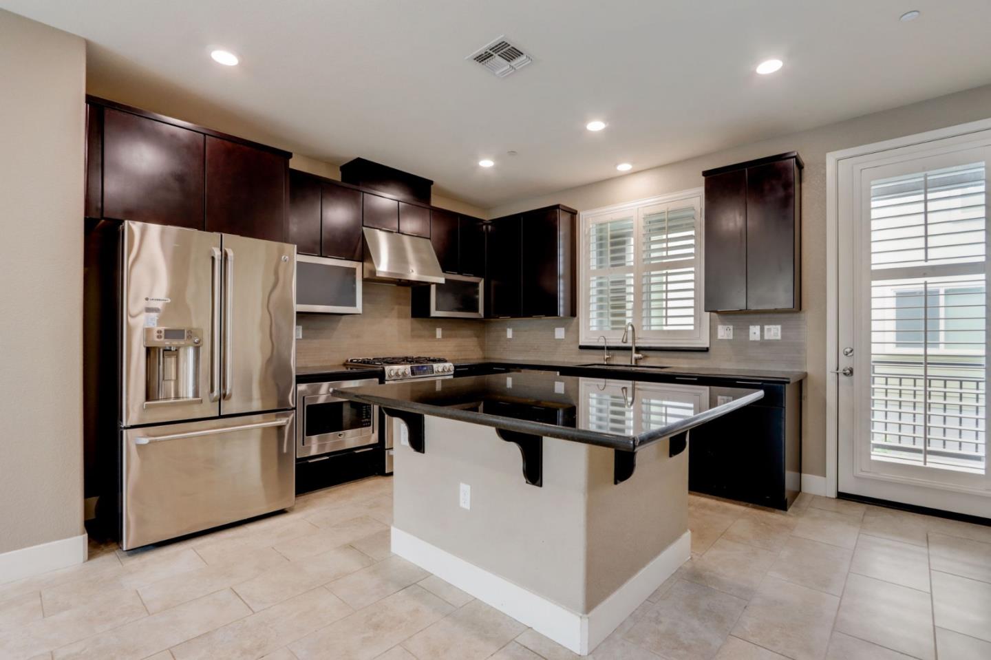 706 Ave One Drive San Jose, CA 95123 - Photo 9 of 60 a kitchen with stainless steel appliances granite countertop a sink stove and refrigerator