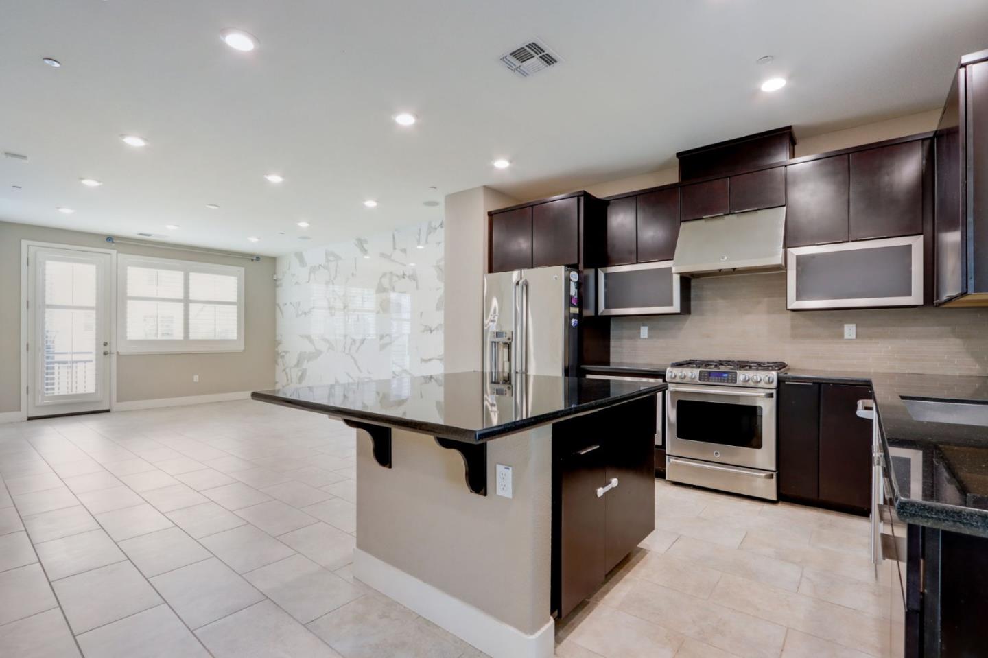 706 Ave One Drive San Jose, CA 95123 - Photo 10 of 60 a kitchen with stainless steel appliances granite countertop a sink and a stove