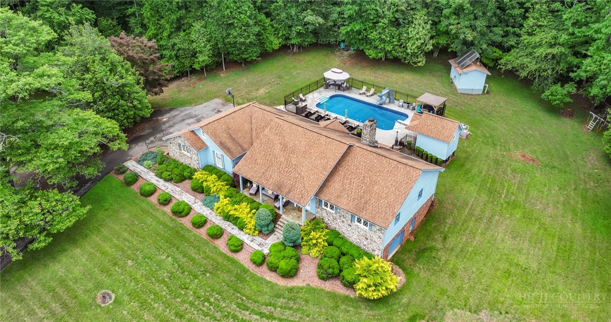 1335 Shingle Gap Road Purlear, NC 28665 - Photo 8 of 49 an aerial view of a house with outdoor space pool seating area and yard