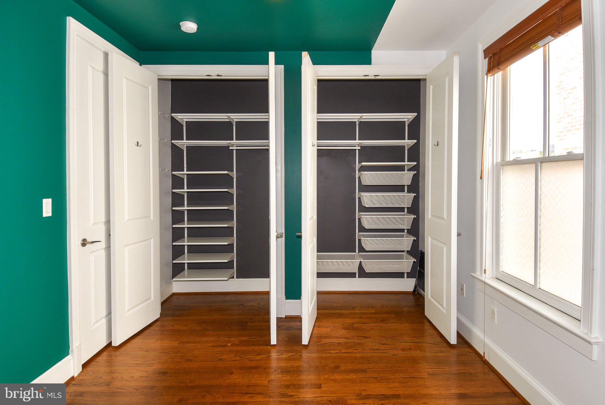 1316 9th Street Northwest Washington, DC 20001 - Photo 17 of 44 Stylish dual closet with vibrant walls.