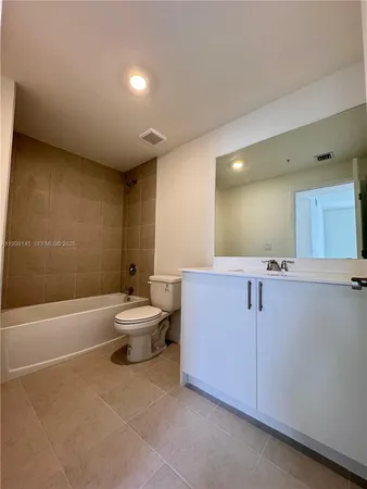 a bathroom with a sink a toilet and a bathtub