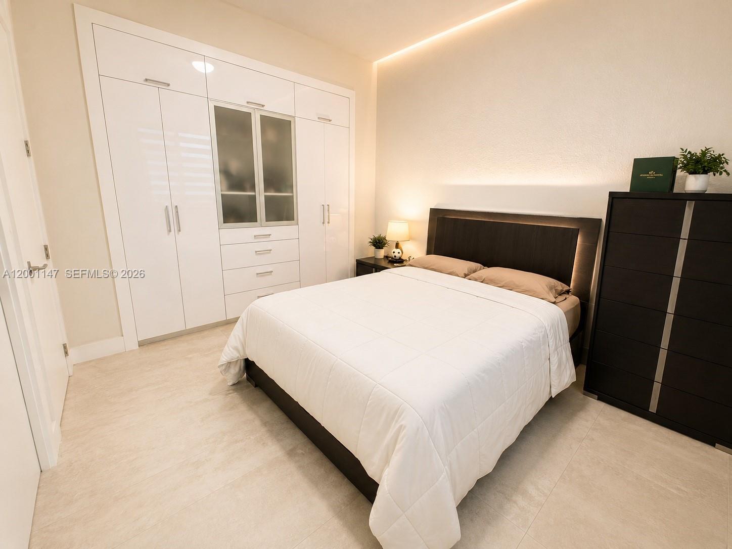 14531 Southwest 21st Street Miami, FL 33175 - Photo 12 of 25 a bedroom with a bed and window