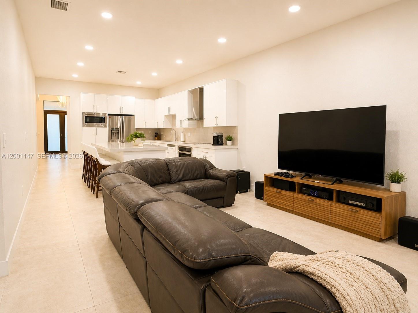 14531 Southwest 21st Street Miami, FL 33175 - Photo 16 of 25 a living room with furniture and a flat screen tv
