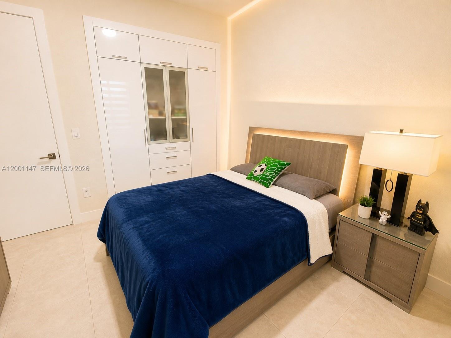 14531 Southwest 21st Street Miami, FL 33175 - Photo 18 of 25 a bedroom with a bed and wooden floor