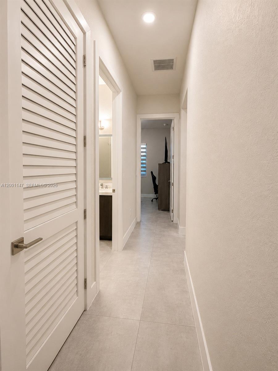 14531 Southwest 21st Street Miami, FL 33175 - Photo 21 of 25 a view of a hallway with an entryway and closet