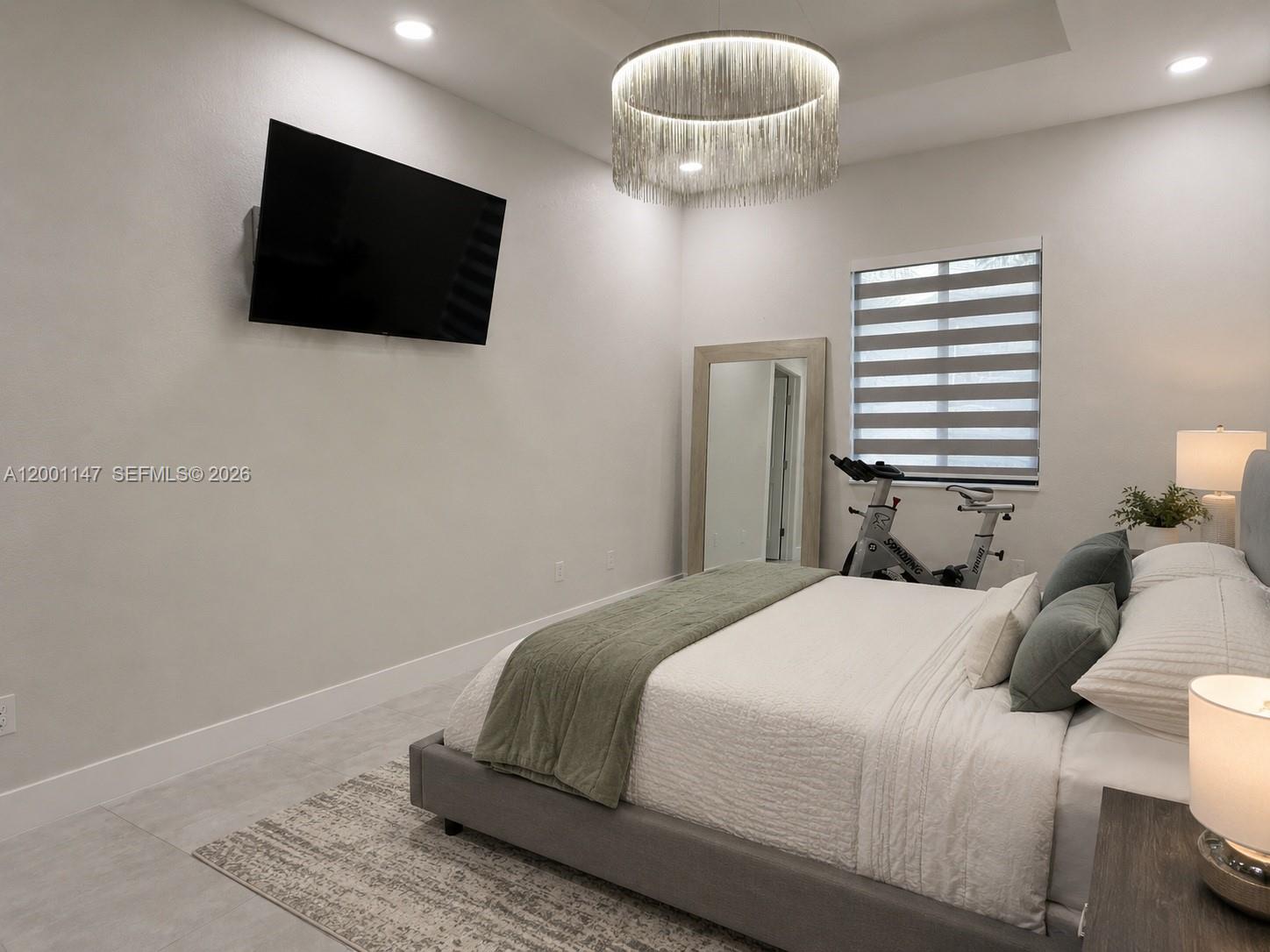14531 Southwest 21st Street Miami, FL 33175 - Photo 22 of 25 a bedroom with a bed and a flat screen tv