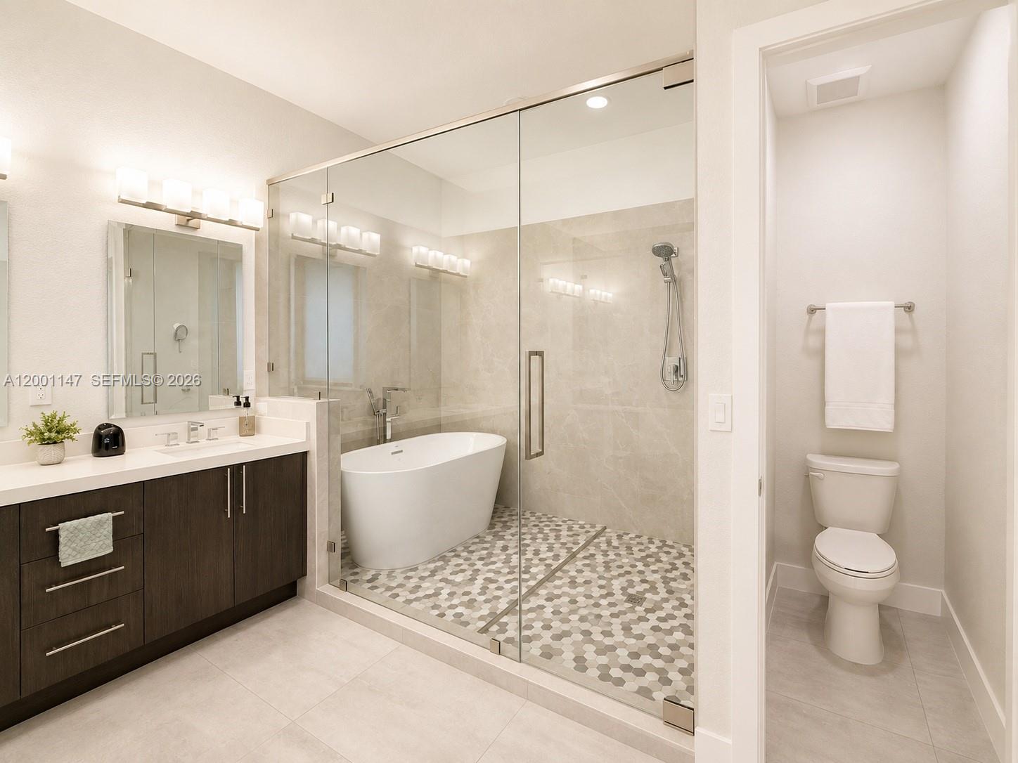 14531 Southwest 21st Street Miami, FL 33175 - Photo 25 of 25 a spacious bathroom with a double vanity sink toilet mirror and bathtub