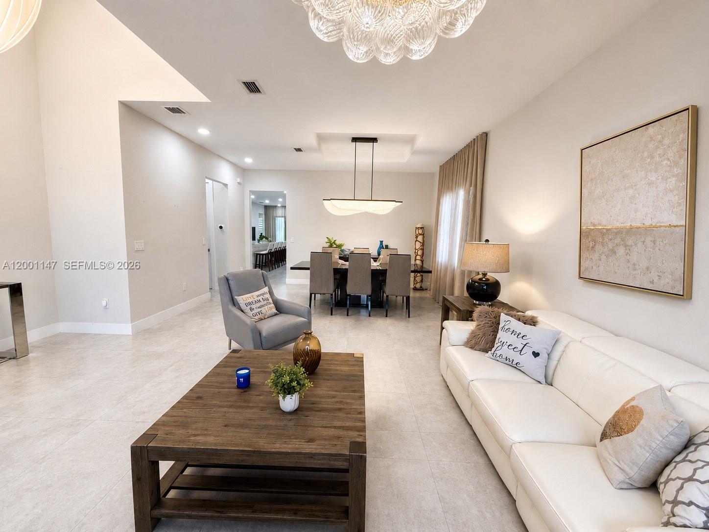 14531 Southwest 21st Street Miami, FL 33175 - Photo 5 of 25 a living room with furniture and a chandelier