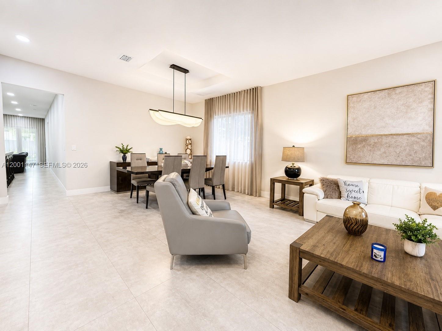 14531 Southwest 21st Street Miami, FL 33175 - Photo 7 of 25 a living room with furniture and a chandelier