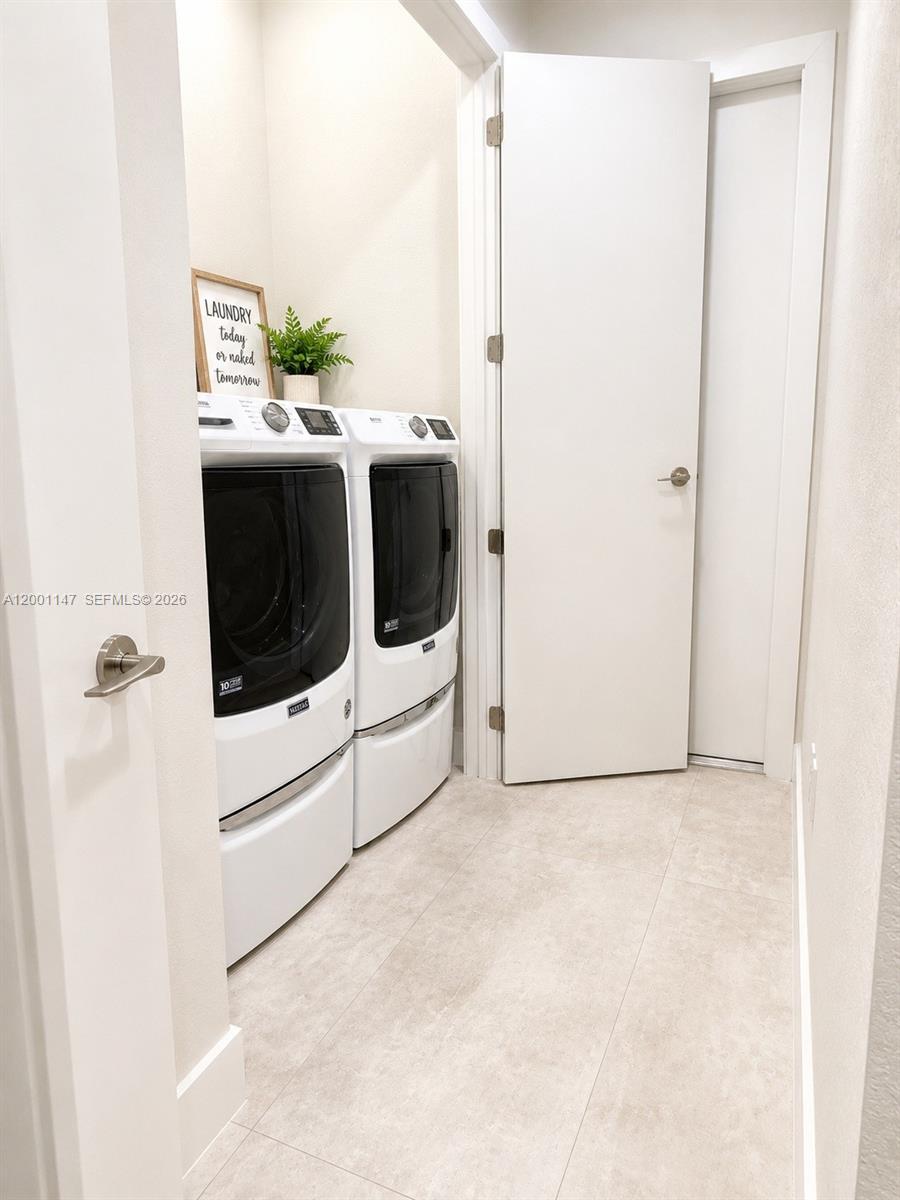 14531 Southwest 21st Street Miami, FL 33175 - Photo 8 of 25 a utility room with dryer and washer