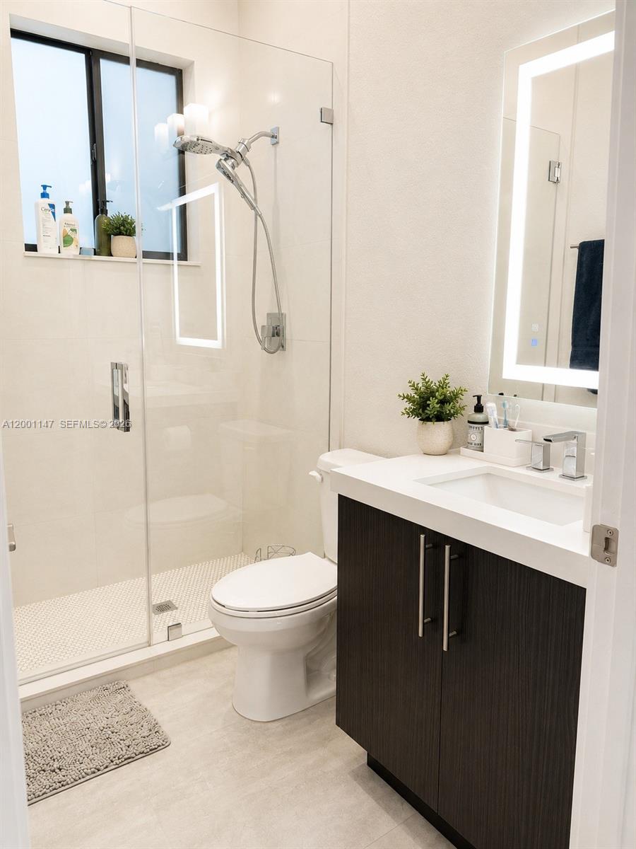 14531 Southwest 21st Street Miami, FL 33175 - Photo 10 of 25 a bathroom with a sink toilet and shower