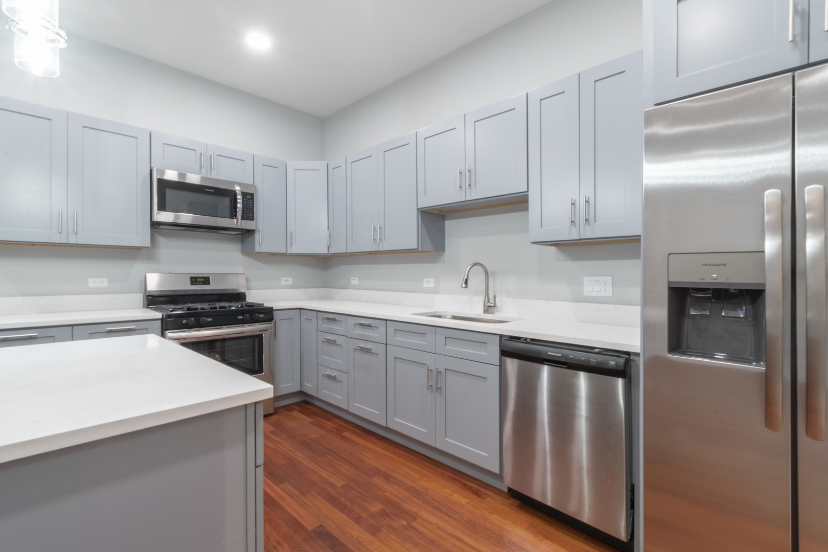 23 West Hubbard Street, Unit 4A Chicago, IL 60654 - Photo 3 of 8 a kitchen with cabinets stainless steel appliances and a sink